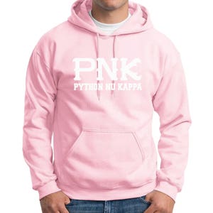 May include: A pink hooded sweatshirt with the text "PNK PYTHON NU KAPPA" in white.