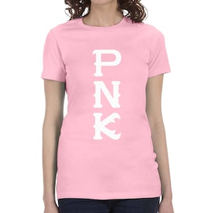May include: A pink women's t-shirt with the word "PNK" printed in white on the front.