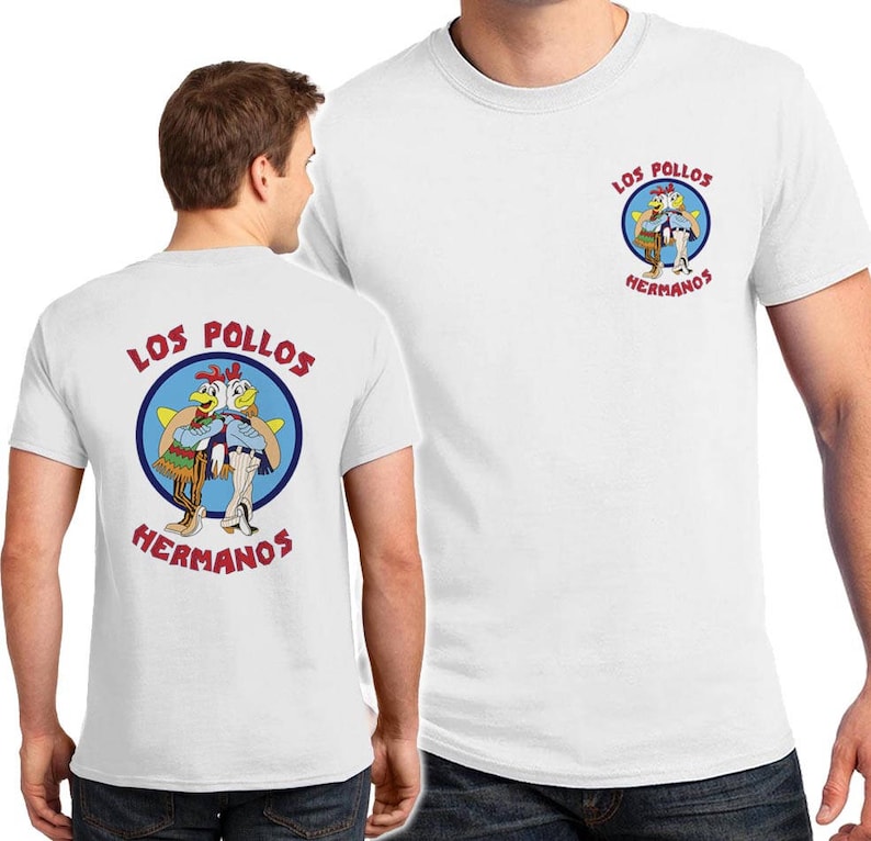 May include: Two white t-shirts with a red and blue logo on the front. The logo features two cartoon chickens with the text "Los Pollos Hermanos".