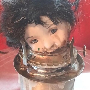 Weird mounted porcelain doll head, Mixed media found object assembled art doll
