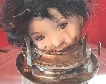 Weird mounted porcelain doll head, Mixed media found object assembled art doll