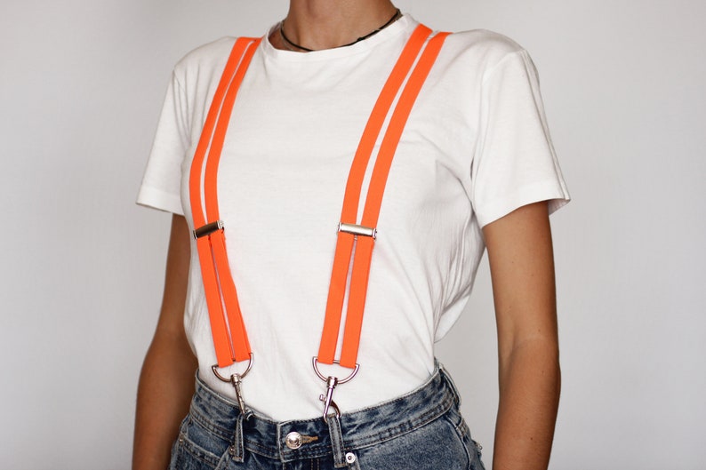 Birds of Prey hot orange suspenders with silver diamond on the b Birds of Prey hot orange suspenders with silver diamond on the b