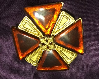 Truly 1970s brooch with lucite faux amber in gold tone setting