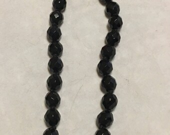 Black Austrian glass necklace marked Austria.