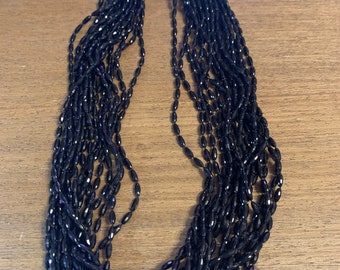 1960s or 1970s black plastic beads marked Hong Kong