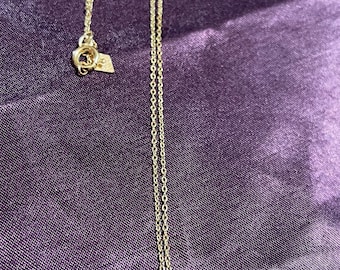 Tiny faux pearl pendant on gold tone chain. Sarah Coventry