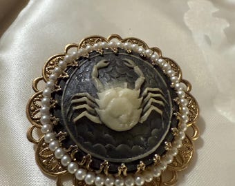 Molded plastic cameo cancer sun sign with faux pearls vintage