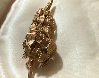 Leaf and catkin gold tone brooch
