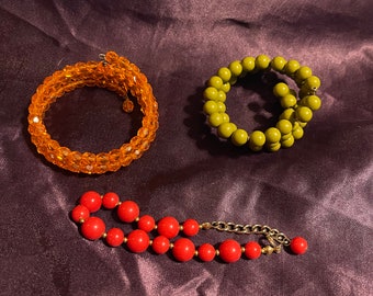 Lot 3 vintage spring and or beaded bracelets mid century