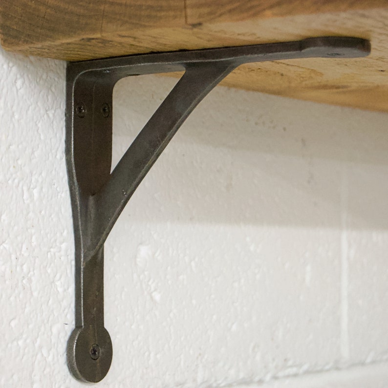 Side view of cast iron wall support showing depth and strength