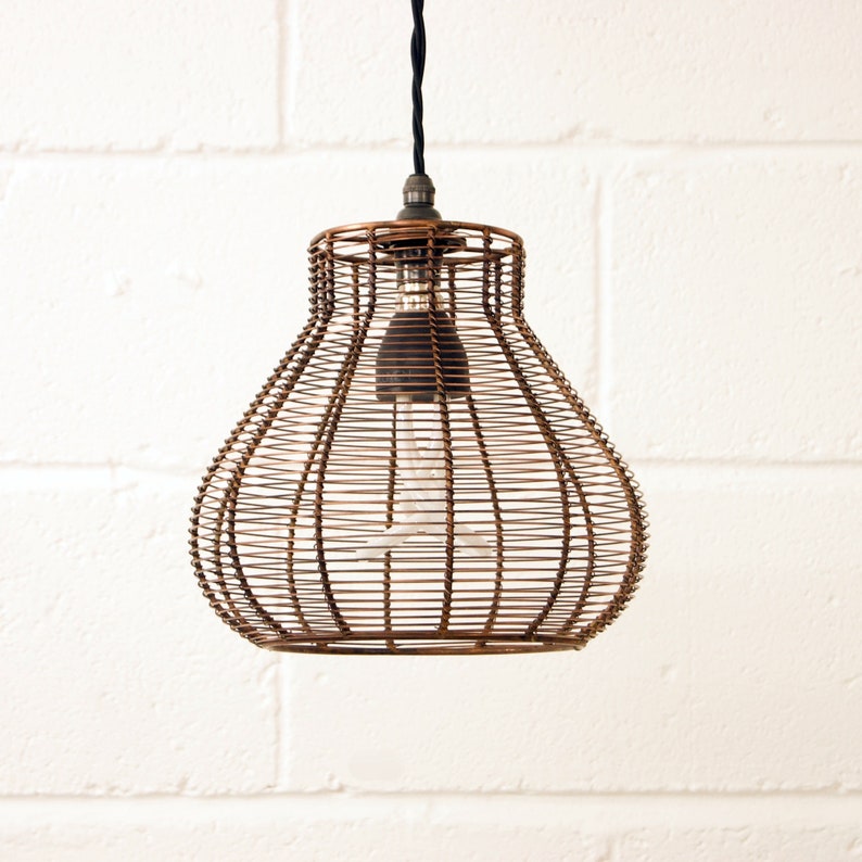 A bronze metal bell cage retro pendant hanging light shade, with a braided cord