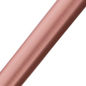 May include: A roll of rose gold satin ribbon. The ribbon is smooth and shiny.