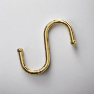 One brass S-hook which serves as a useful hook for hanging various items.