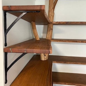 Industrial cast iron wall support installed in kitchen shelving