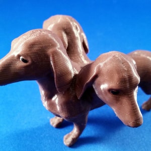 Cerberus, Kinder and Gentler - A 3-Headed Wiener dog!