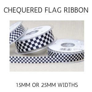 May include: Black and white chequered flag ribbon on spools, with the text "CHEQUERED FLAG RIBBON" and "15MM OR 25MM WIDTHS". The ribbon is available in 15mm or 25mm widths.