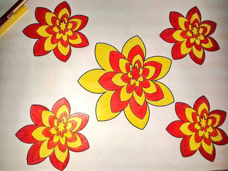 May include: Hand-drawn illustration of five stylized flowers. Each flower features a layered design with red, yellow, and orange hues. The flowers are arranged on a white background, with a few colored pencils visible in the upper left corner.
