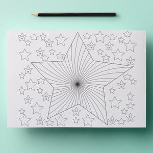 May include: A black and white star-themed coloring page with a large star in the center and smaller stars surrounding it. The large star has a spiral design. A black pencil rests at the top of the page. The coloring page is on a light blue background.