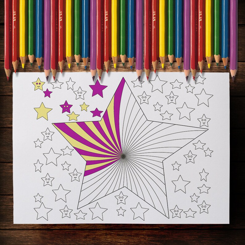 May include: A coloring page with a large star design, partially colored with yellow and purple stripes, surrounded by smaller star outlines. A row of colored pencils in various colors sits above the page.