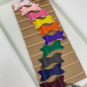 Set of 10 Faux leather bows, baby headbands, mini leather bows, leather bow baby headband set. Nylon headbands Christmas bows