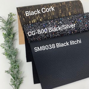 May include: Three different black fabric swatches. The top swatch is a cork fabric with gold flecks and the text "Black Cork". The middle swatch is a black fabric with silver and multi-colored glitter and the text "CG-800 Black/Silver". The bottom swatch is a black textured fabric with the text "SM8038 Black litchi".