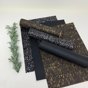 May include: A set of five black and gold patterned fabric sheets. The sheets are made of a variety of materials, including glitter, cork, and faux leather.