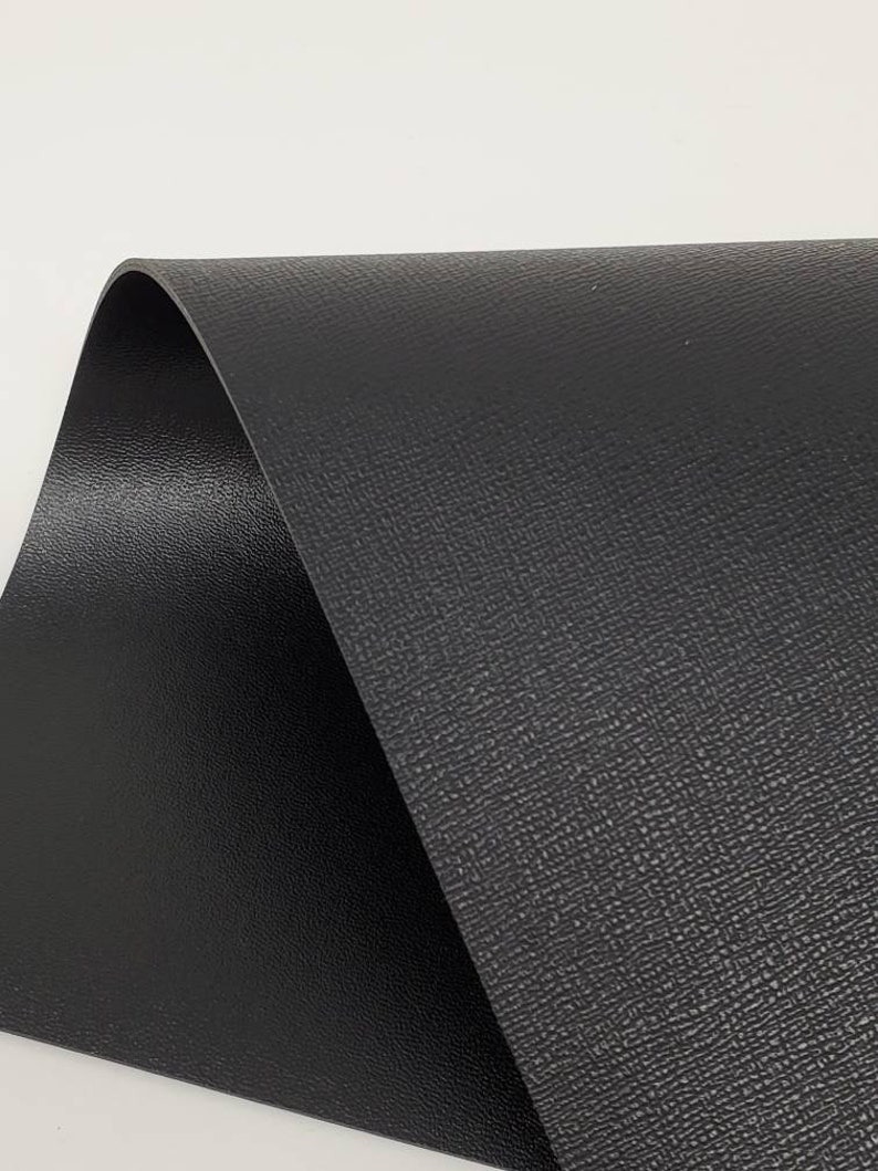 Double sided leather. Smooth on one side linen texture on the Etsy