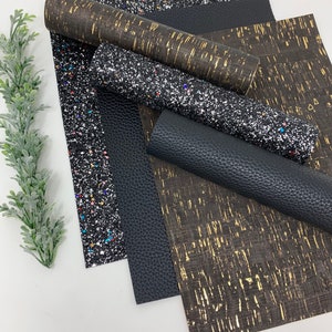 May include: A set of five different faux leather sheets. The sheets are black, brown, and black with gold glitter. The sheets are all textured.