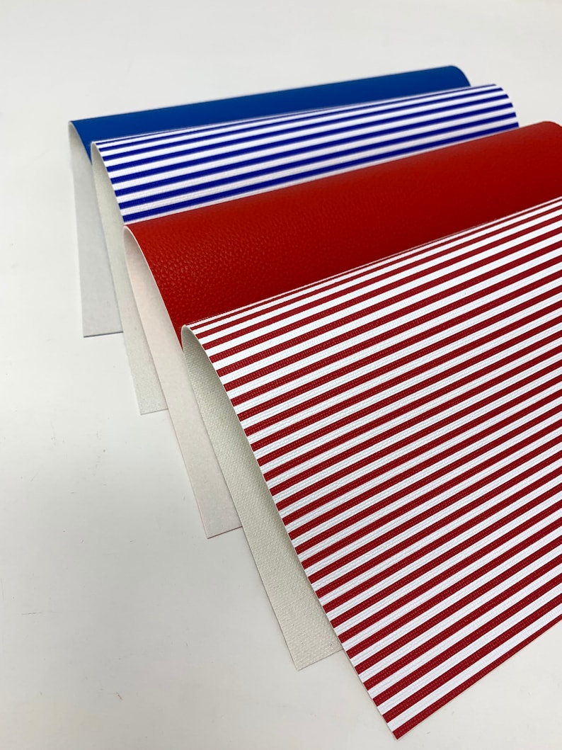May include: Four different fabric samples, including a red solid, a red and white striped fabric, a blue solid, and a blue and white striped fabric.