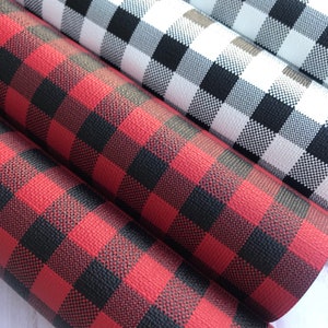 May include: Three rolls of buffalo plaid fabric in red and black, white and black, and brown and black.