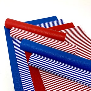 May include: Red and blue striped faux leather sheets. The sheets are rolled up and stacked on top of each other. The stripes are white and the background colors are red and blue.