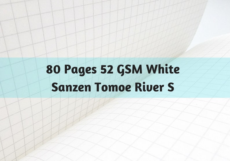 Puede incluir: P&aacute;ginas de cuaderno abiertas con un patr&oacute;n de cuadr&iacute;cula. El texto de la imagen dice: "80 Pages 52 GSM White Sanzen Tomoe River S."