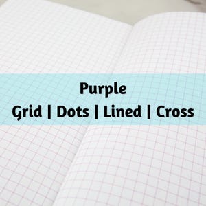 May include: Open notebook with white pages and a grid pattern. The text "Purple Grid | Dots | Lined | Cross" is displayed on a light blue banner across the pages. The grid lines are in a light purple color.