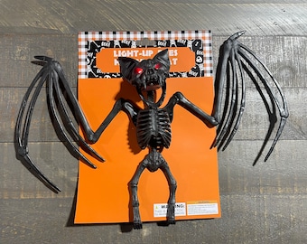 New with tags - Light up plastic bat skeleton