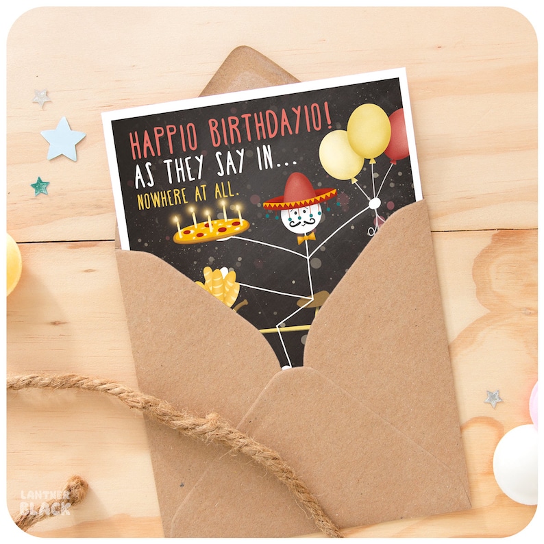 May include: A birthday card with a stick figure wearing a sombrero and holding a pizza with candles. The card says "Happio Birthdayio! As they say in... Nowhere at all."