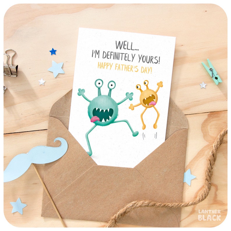 May include: A card with a green and yellow monster illustration. The card reads "Well... I'm definitely yours! Happy Father's Day!"