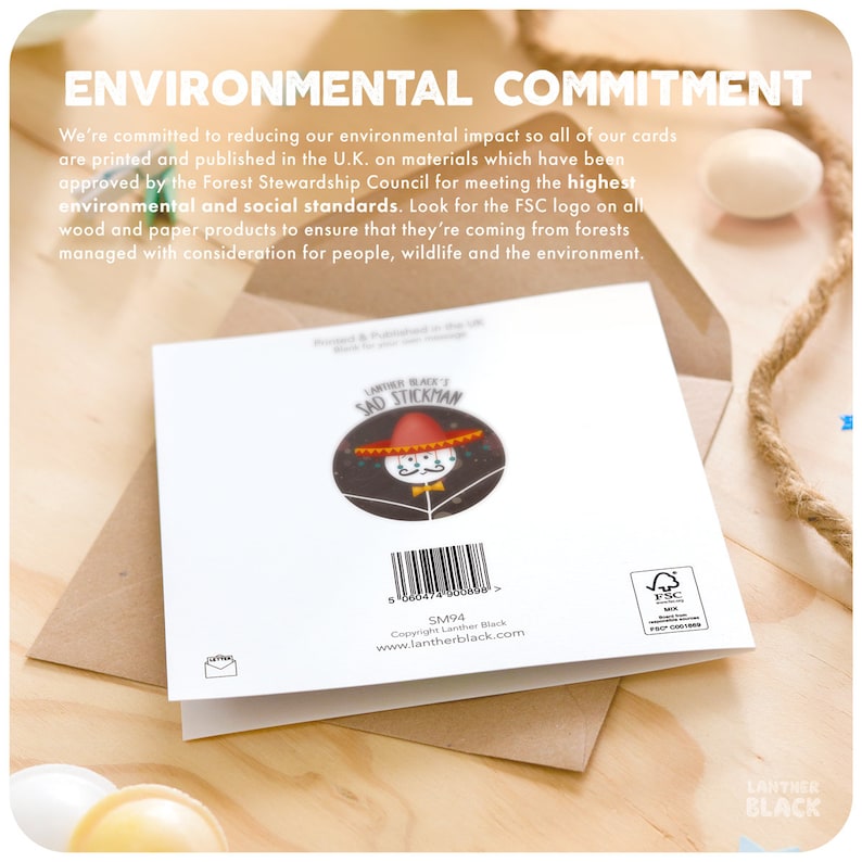 May include: Back of a greeting card with a cartoon illustration of a sad stick figure wearing a sombrero. The card is white with black text that reads "Lanther Black's Sad Stickman" and "SM94". The card also has a barcode and a small FSC logo.
