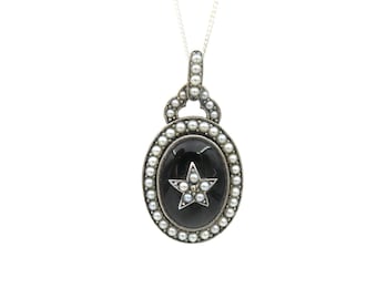 Vintage onyx pendant set in silver with seed pearls on a fine silver chain.