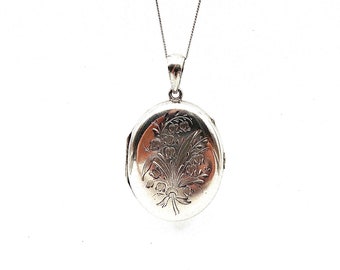 Engraved vintage locket, large oval silver locket with foliate engraving on a silver chain.