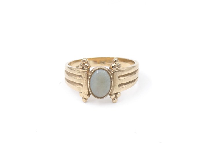 Vintage opal ring, an unusual ring set with oval opal in an ornate gold band