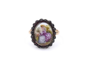 Antique hand painted gold ring, porcelain ring painted with a lady surrounded by a border of garnets.