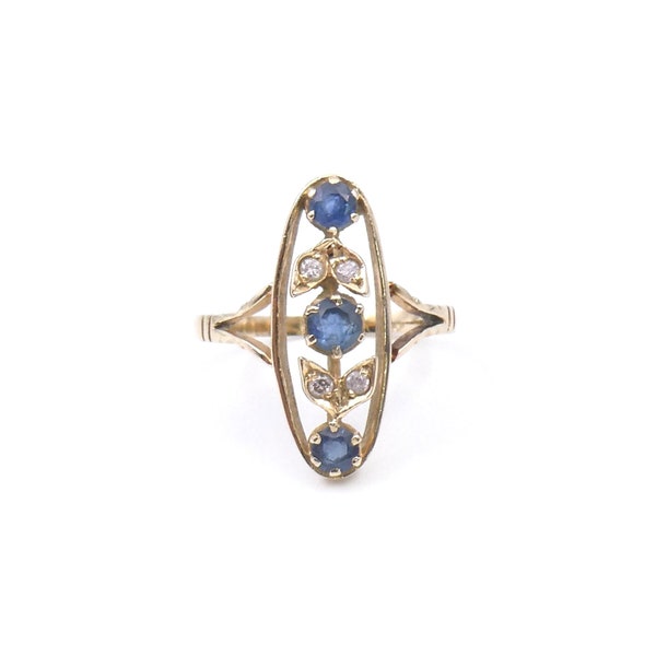 Art Deco style sapphire ring, three sapphire ring set with diamonds with leaf motif setting in 14kt gold.