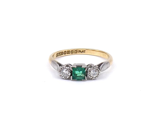 Three stone emerald and diamond ring in platinum and 18kt gold