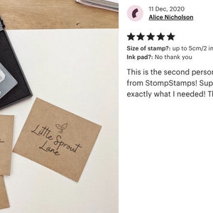 May include: Three brown paper cards with the text "Little Sprout Lane" and a small green sprout graphic printed on each. A black ink pad and a wooden stamp with the same text and graphic are also shown.