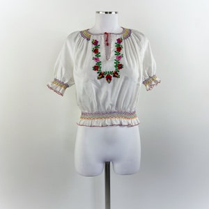 Blusa camicia vintage anni 70 con ricamo floreale.