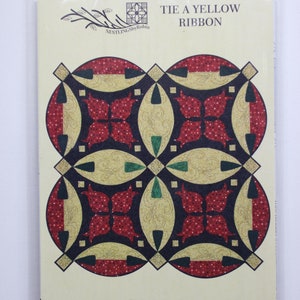 Quilt pattern.  Tie a Yellow Ribbon:  wheelchair lap or wall hanging 37 inches square, piecing and hand applique.  Wheelchair lap quilt.