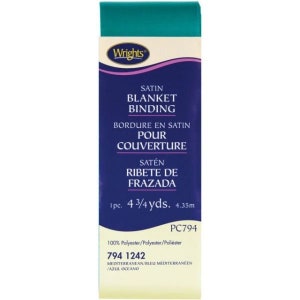 May include: A teal satin blanket binding with the text "Wrights Satin Blanket Binding" and "1pc. 4 3/4 yds. 4.35m" on a blue and white label.