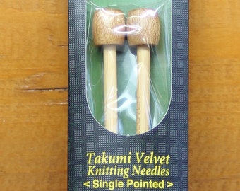 Takumi bamboo knitting needles by Clover.  Sizes US 0-10 1/2.