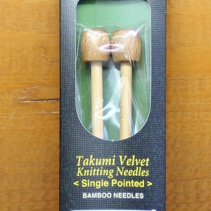 Takumi bamboo knitting needles by Clover.  Sizes US 0-10 1/2.