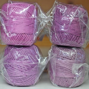 Lizabeth crochet or tatting thread.  Size 20 or 40 cotton crochet thread.